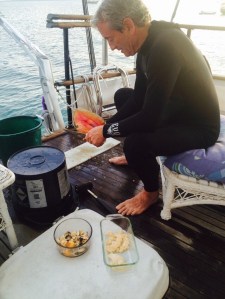 Tom the conch man cleaning his catch
